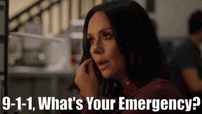 A Woman Talking On A Cell Phone With The Words 9-1-1 What 'S Your Emergency Written Below Her GIF
