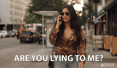 A Woman Talking On A Cell Phone With The Words " Are You Lying To Me " Above Her GIF