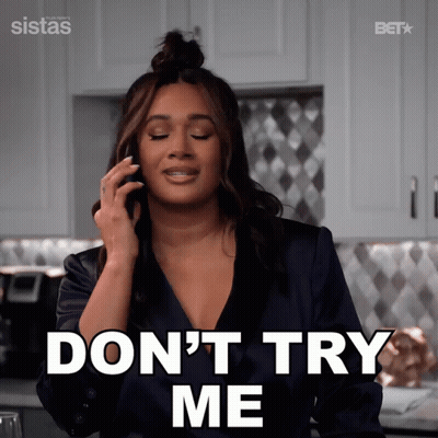 A Woman Talking On A Cell Phone With The Words " Do N't Try Me " Behind Her GIF