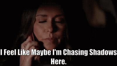 A Woman Talking On A Cell Phone With The Words " Feel Like Maybe I 'M Chasing Shadows Here " Below Her GIF
