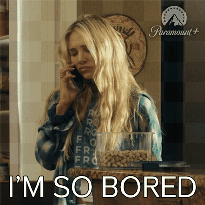A Woman Talking On A Cell Phone With The Words I 'M So Bored Behind Her GIF