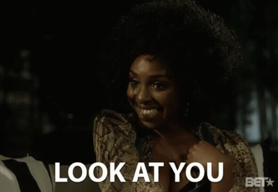 A Woman Talking On A Cell Phone With The Words Look At You Above Her GIF