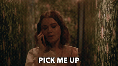 A Woman Talking On A Cell Phone With The Words Pick Me Up Above Her Head GIF