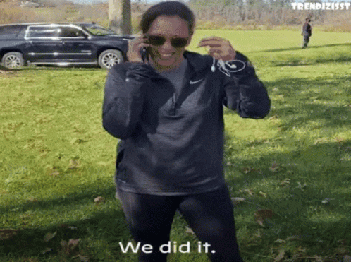 A Woman Talking On A Cell Phone With The Words " We Did It " Written On The Bottom GIF
