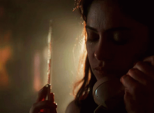 Woman Talking On Phone With Eyes Closed GIF
