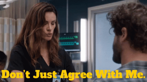 A Woman Talking To A Man With The Words " Do N't Just Agree With Me " GIF