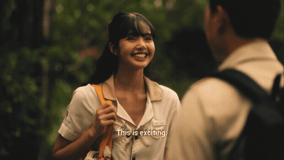 A Woman Talking To A Man With The Words " This Is Exciting " GIF