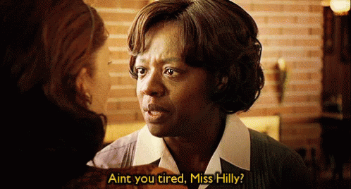 A Woman Talking To Another Woman With The Words " Aint You Tired Miss Hilly " On The Bottom GIF