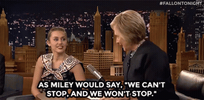 A Woman Talking To Another Woman With The Words " As Miley Would Say " On The Screen GIF