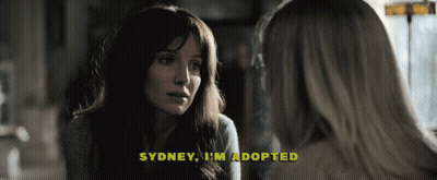 A Woman Talking To Another Woman With The Words Sydney I 'M Adopted Above Her GIF
