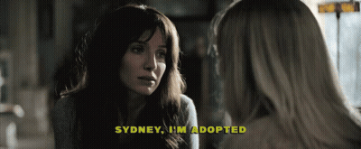 A Woman Talking To Another Woman With The Words Sydney I 'M Adopted Above Her GIF
