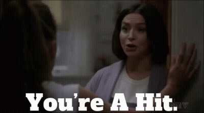 A Woman Talking To Another Woman With The Words " You 'Re A Hit " GIF