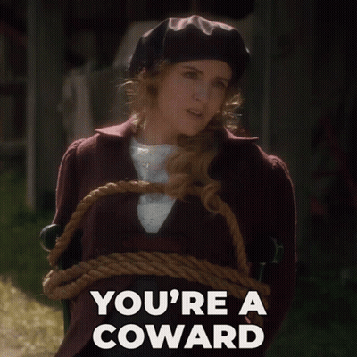 A Woman Tied Up With A Rope And The Words You 'Re A Coward Above Her GIF