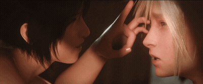 A Woman Touches Another Woman 'S Nose With Her Finger GIF