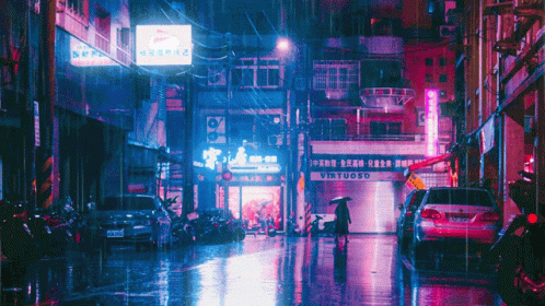 A Woman Walking Down A Wet Street In Front Of A Virtuoso Restaurant GIF