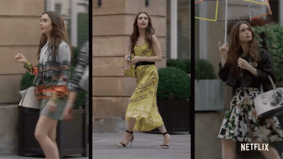 A Woman Walking Down The Street With A Netflix Logo On The Bottom GIF