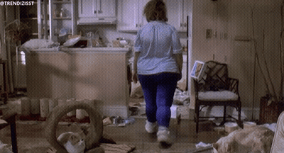 A Woman Walking Through A Messy Kitchen With The Hashtag Trendizisst GIF
