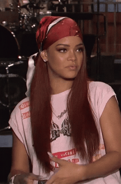 A Woman Wearing A Bandana And A Vacant Shirt GIF