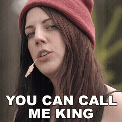 A Woman Wearing A Beanie Has A Flower In Her Mouth And Says You Can Call Me King GIF