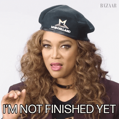 A Woman Wearing A Beret That Says Modellard On It Says I 'M Not Finished Yet GIF
