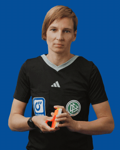 A Woman Wearing A Black Adidas Shirt Holds A Yellow Card GIF