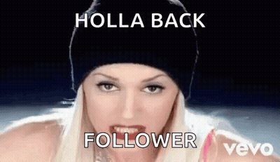 A Woman Wearing A Black Beanie Is Making A Funny Face With The Words Holla Back Follower Written On The Bottom . GIF