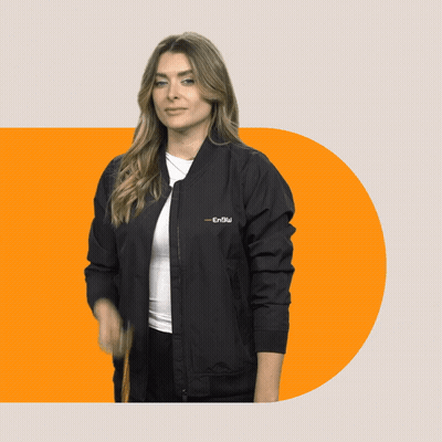 A Woman Wearing A Black Bomber Jacket That Says ' Enolu ' On It GIF