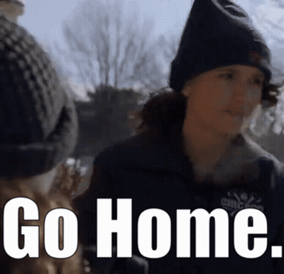 A Woman Wearing A Black Hat And A Jacket Says Go Home GIF