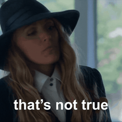 A Woman Wearing A Black Hat And A White Shirt Says That 'S Not True GIF