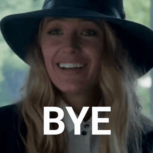 A Woman Wearing A Black Hat Is Smiling With The Word Bye Behind Her GIF