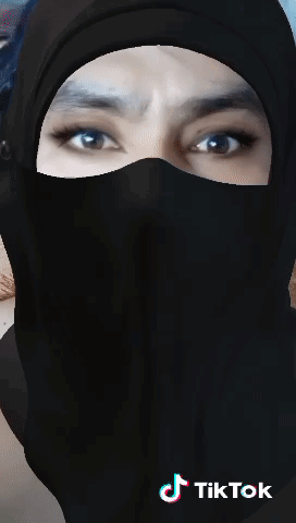 A Woman Wearing A Black Hijab And A Black Mask With Tiktok Written On The Bottom GIF