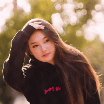A Woman Wearing A Black Hoodie That Says Zoom I Kiss GIF