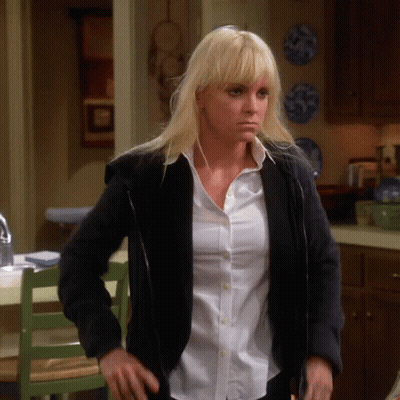 A Woman Wearing A Black Jacket And A White Shirt GIF
