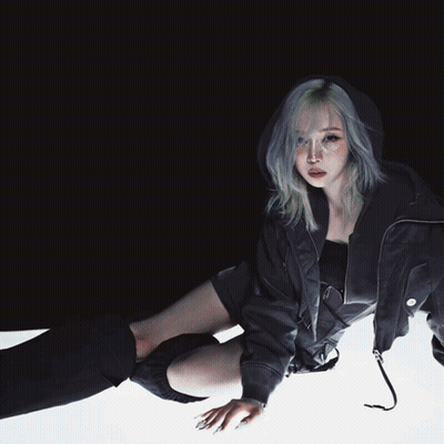 A Woman Wearing A Black Jacket And Black Knee High Socks GIF