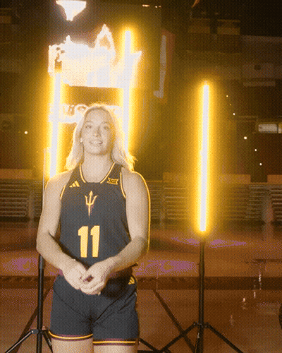 A Woman Wearing A Black Jersey With The Number 11 GIF