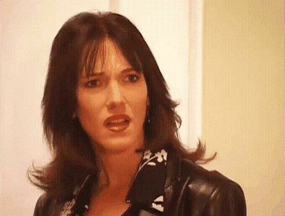 A Woman Wearing A Black Leather Jacket Looks Angry GIF