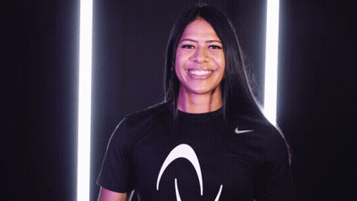 A Woman Wearing A Black Nike Shirt With The Letter V On It GIF