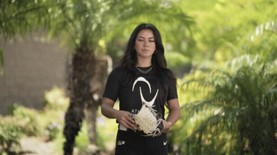 A Woman Wearing A Black Shirt That Says " Athletic " GIF