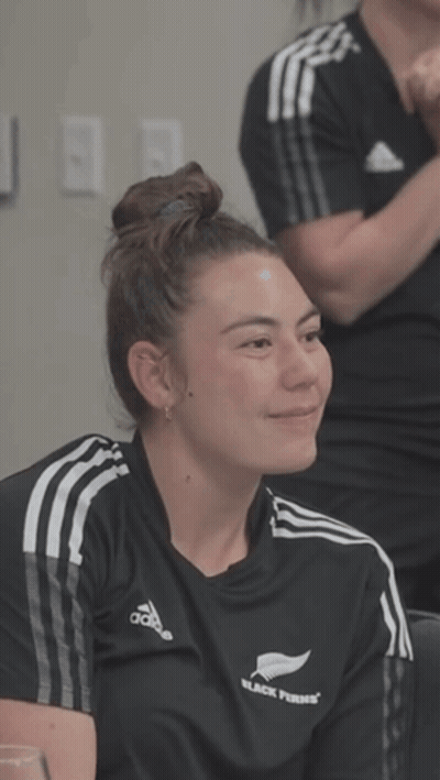 A Woman Wearing A Black Shirt That Says Black Ferns On It GIF