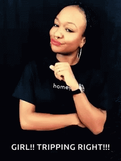A Woman Wearing A Black Shirt That Says Homes GIF