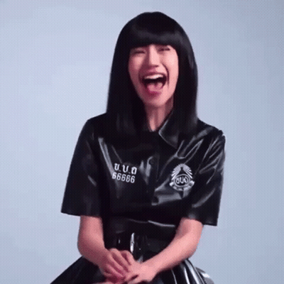 A Woman Wearing A Black Shirt With The Number 66666 On The Sleeve GIF
