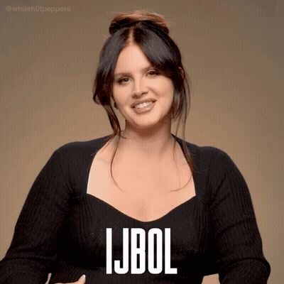 A Woman Wearing A Black Sweater With The Word Ljbol Written On It GIF