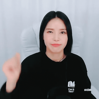 A Woman Wearing A Black Sweatshirt That Says Luck Lard GIF
