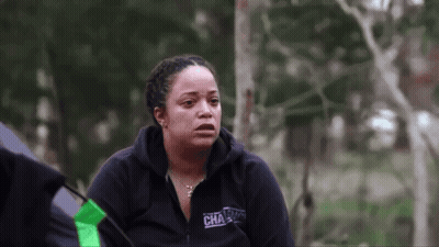 A Woman Wearing A Black Sweatshirt With The Word Challenge On It GIF