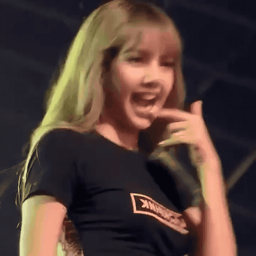 A Woman Wearing A Black T-Shirt That Says Blackpink On It GIF