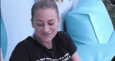 A Woman Wearing A Black T-Shirt That Says " You May Think I 'M A Dream Come True " GIF