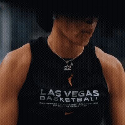 A Woman Wearing A Black Tank Top That Says Las Vegas Basketball On It GIF