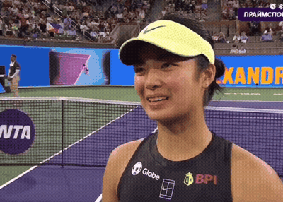 A Woman Wearing A Black Tank Top With Globe Bpi And Nike Logos On It GIF