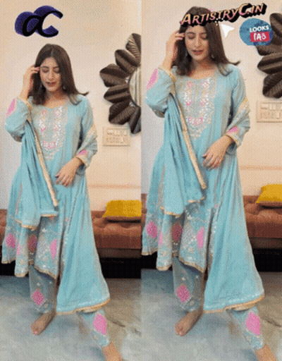 A Woman Wearing A Blue And Pink Dress With The Words Artistry Can Looks Fab GIF