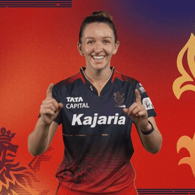A Woman Wearing A Blue And Red Shirt That Says Kajaria GIF